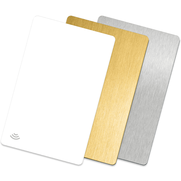 Three blank cards: white with contactless symbol, gold brushed metal, and silver brushed metal.