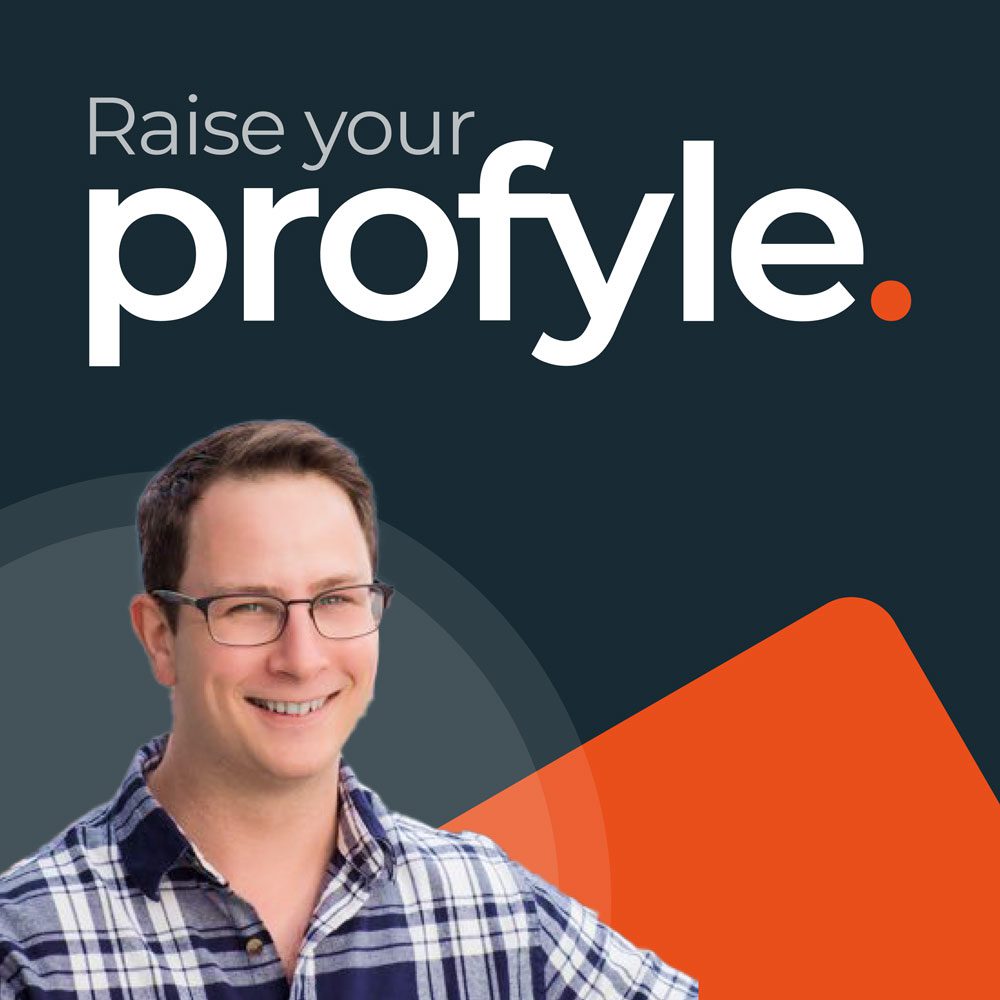 Man smiling with glasses and plaid shirt, text 'Raise your profyle.' with an orange dot.