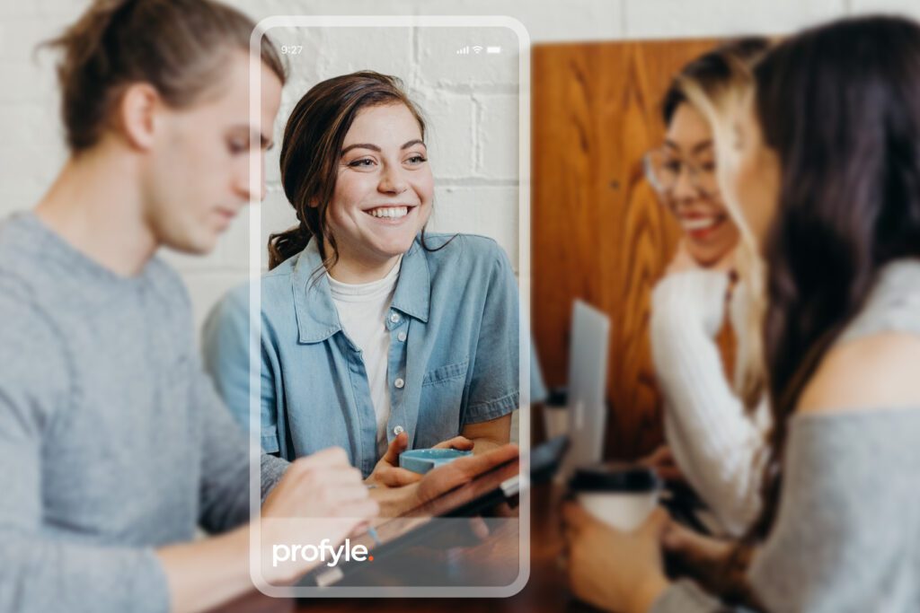 Smiling woman on a phone screen with 'profyle.' text, overlaid on blurred people interacting.